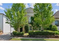 Charming two-story brick home with mature landscaping and a cozy, inviting curb appeal at 6925 Colfax Ave, Cumming, GA 30040
