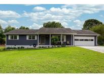 Charming single-story home with a well-manicured lawn, attached garage, and classic design at 4812 Pamela Nw Ct, Acworth, GA 30101