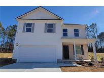 Charming two-story home with white siding, grey shutters, attached garage, and a well-manicured lawn at 2 Loth Wages (Lot 2) Rd, Dacula, GA 30019