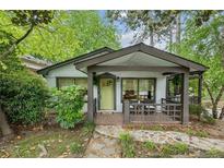 Charming cottage-style home with a covered porch and brick walkway at 901 United Se Ave, Atlanta, GA 30316