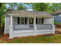 Charming single-story home with a cozy covered porch and freshly painted light gray siding at 1939 Dunlap Ave, Atlanta, GA 30344