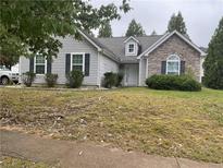 Charming single-story home with stone accents, manicured lawn, and inviting curb appeal at 4874 Larkspur Ln, Atlanta, GA 30349