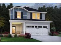 Charming two-story home with a two-car garage, stone accents, and manicured landscaping at 5045 Paravicini Pl, Cumming, GA 30041