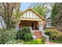 Charming craftsman-style home with a brick walkway and beautiful landscaping at 171 Westminster Ne Dr, Atlanta, GA 30309