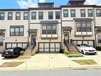 Charming townhomes feature private garages and welcoming entrances with landscaped stairs at 1127 Provence Ln, Decatur, GA 30033