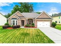 Charming brick home with a manicured lawn, attached garage, and inviting curb appeal at 3700 Long Lake Dr, Douglasville, GA 30135