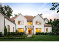 Stunning two-story home featuring a manicured front yard, stone accents, and a welcoming entrance at 490 Mount Paran Rd, Atlanta, GA 30327