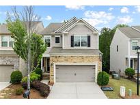 Charming two-story home features a stone facade and attached two-car garage at 4625 Cold Spring Court, Cumming, GA 30041