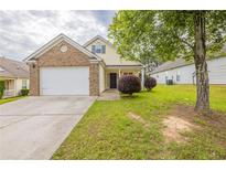 Charming single-Gathering home with a well-maintained lawn and attached two-car garage at 3531 Brookstone Way, Union City, GA 30291