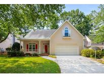 Charming single-Gathering home with a well-manicured lawn, two-car garage, and inviting front porch at 4481 Mccart Cv, Stone Mountain, GA 30083