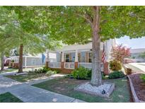 Charming light blue two-story home featuring a welcoming front porch with white railings and an American flag at 230 Ryan Ln, Covington, GA 30014