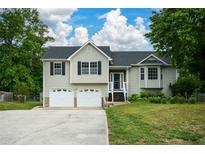 Charming two-story home featuring a two-car garage and well-manicured lawn in a desirable neighborhood at 30 W Fork Way, Temple, GA 30179