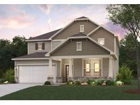 Charming two-story home featuring stone accents, a covered porch, and a two-car garage at 670 Redhead Way (Lot 23), Grayson, GA 30017