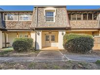 Charming townhome with a welcoming front entrance and well-maintained landscaping at 123 Rue Fontaine, Lithonia, GA 30038