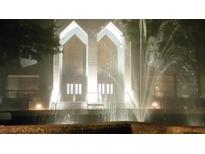 An eye-catching building entrance is illuminated and features a beautiful water feature in the foreground at 2870 Pharr Court South Nw # 901, Atlanta, GA 30305