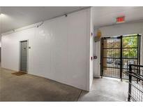 Hallway view featuring a door and gate leading to the exterior at 821 Ralph Mcgill Ne Blvd # 2113, Atlanta, GA 30306