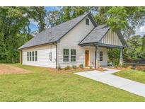 Charming craftsman-style home featuring a well-manicured lawn and inviting front porch at 2621 Oldknow Nw Dr, Atlanta, GA 30318