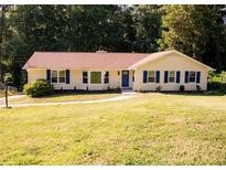 Charming single-story home featuring a well-manicured lawn and inviting exterior at 2751 Colonial Dr, College Park, GA 30337