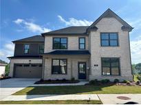 Beautiful two-story home with a two car garage, manicured lawn and gorgeous curb appeal at 4191 Hosch Reserve Dr, Buford, GA 30519