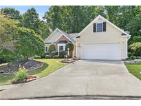 Charming one-story home with manicured landscaping and a two-car garage at 2700 White Blossom Ln, Suwanee, GA 30024