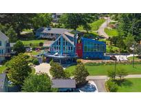 Stunning multi-level home with unique architecture and waterfront views, perfect for luxury living at 4940 Sunrise Ln, Cumming, GA 30041