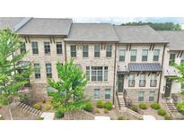 Charming brick townhomes with well-maintained landscaping and inviting curb appeal at 614 Harrington Hls, Decatur, GA 30032