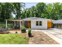 Charming single-story home with a covered porch, manicured lawn, and walkway at 435 Mcwilliams Se Ave, Atlanta, GA 30316