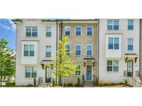 Townhome featuring painted brick and visible address number at 3313 Bartee Walk, Suwanee, GA 30024