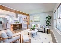 Bright living room with an open floor plan, wooden accents, and modern decor at 3627 Groovers Lake Rd, Lithia Springs, GA 30122