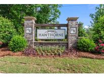 Hawthorne Ridge community sign with manicured landscaping and flowers at 221 Begonia Way, Mcdonough, GA 30253