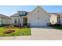 Charming single-Gathering home featuring a well-manicured lawn and inviting two-car garage at 1682 Juniper Berry Way, Loganville, GA 30052