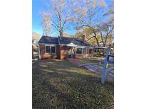 Quaint brick home with mature trees and front yard at 6 Rockmart Sw Dr, Atlanta, GA 30314