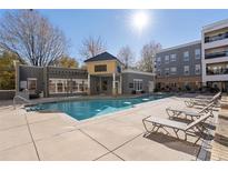 Community pool area with lounge chairs and manicured landscaping at 870 Inman Village Ne Pkwy # 229, Atlanta, GA 30307