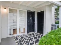 Inviting entryway with a stylish rug and natural light streaming through the adjacent window at 1150 Collier Nw Rd # 25D, Atlanta, GA 30318