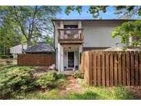 Charming townhome with a private balcony and fenced front yard offering a cozy outdoor space at 82 Twiggs Cor, Peachtree City, GA 30269