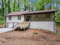 Charming two-story home boasts a welcoming front porch and a two-car garage at 641 Charing Cross Dr, Marietta, GA 30066