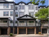 Charming townhouse with a private balcony, stone accents, and a two-car garage at 221 Semel Nw Dr # 273, Atlanta, GA 30309