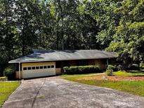 Charming ranch home featuring mature landscaping and a two-car garage at 2636 Whiteleigh Ne Ct, Atlanta, GA 30345