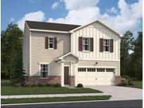 Charming two-story home features a two car garage and neutral siding at 7731 Sudbury Cir, Covington, GA 30014