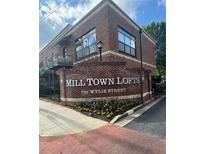 Charming Mill Town Lofts building with brick facade and manicured landscaping on Wylie Street at 791 Wylie Se St # 410, Atlanta, GA 30316