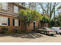 Charming brick building featuring ample parking and mature trees in a landscaped surrounding at 3626 Buford Ne Hwy # C2, Brookhaven, GA 30329