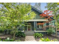 Charming home featuring a covered front porch, beautifully landscaped yard, and inviting curb appeal at 541 Greenwood Ne Ave, Atlanta, GA 30308