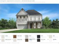 Two-story home with a brick facade, dark roof, and cedar columns on the front porch at 741 Keystone Dr, Woodstock, GA 30188