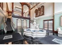 Stately lobby features a grand fountain, elegant staircase, and gleaming black tile floors at 3334 Peachtree Ne Rd # 101, Atlanta, GA 30326