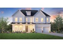 Charming two-story home with a well-manicured lawn and welcoming front porch at 5515 Misty Glen Ln, Cumming, GA 30040