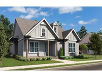 Charming home featuring vertical siding, a covered front porch with detailed trim, and a well-manicured lawn at 515 Godfrey Dr, Cumming, GA 30040