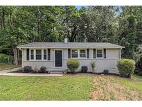 Charming single-story home with a well-manicured front yard and classic black shutters at 442 Cologne Se Dr, Atlanta, GA 30354