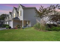 Charming townhome with well-manicured lawn and colorful flower beds at 6918 Gallant Se Cir # 22, Mableton, GA 30126