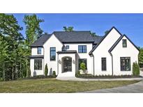 Stunning two-story home with modern black trim and a well-manicured lawn at 2346 East Maddox Rd, Buford, GA 30518