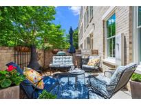 Inviting outdoor patio with cozy seating, a grill, and stylish decor, perfect for relaxation and entertaining guests at 3408 Landen Pine Ne Ct, Atlanta, GA 30305